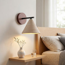 Load image into Gallery viewer, Modern wall lamp with concrete shade in a cozy living room setting.
