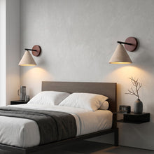 Load image into Gallery viewer, Modern bedroom with a bed, nightstands, and wall sconces.
