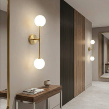 Load image into Gallery viewer, Modern wall sconces in a stylish interior setting with a desk and mirror.