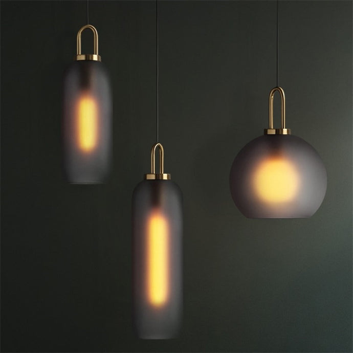 Sleek and modern frosted glass pendants in both cylinder and globe shape