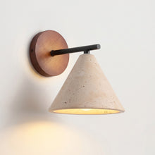Load image into Gallery viewer, Wall-mounted light fixture with wooden base and concrete cone shade on a white wall.
