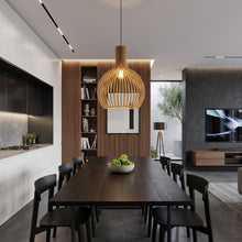 Cargar imagen en el visor de la galería, Modern kitchen and dining area with a wooden pendant light, bookshelf, and TV.
