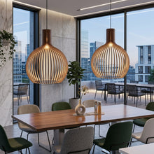 Cargar imagen en el visor de la galería, Modern dining area with wooden table and chairs, featuring two hanging pendant lights.
