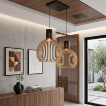 Cargar imagen en el visor de la galería, Modern interior with wooden pendant lights, sideboard, and framed artwork.

