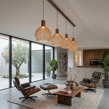 Cargar imagen en el visor de la galería, Modern living room with wooden furniture and pendant lights
