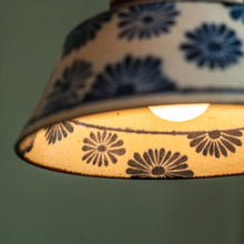 Load image into Gallery viewer, Decorative lampshade with floral pattern on a plain background
