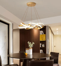 Load image into Gallery viewer, Polished gold unique modern ribbon chandelier for kitchens and dining rooms
