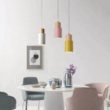 Load image into Gallery viewer, white, yellow, and pink wood base pendant lights
