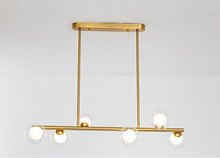 Load image into Gallery viewer, 6 bulb clear glass globe horizontal modern chandelier with brass accents

