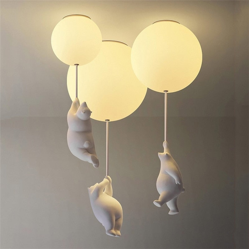Ceiling Mounted Globe Lights with Hanging Polar Bears for a Children's Bedroom