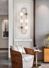 Load image into Gallery viewer, Polished Brass Multi-Bulb Wall Sconce

