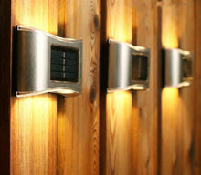 Load image into Gallery viewer, Solar LED Outdoor Wall Lights in warm light
