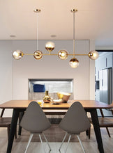 Load image into Gallery viewer, Modern Multi-Bulb Chandelier in gold with smokey gray glass lamp shades
