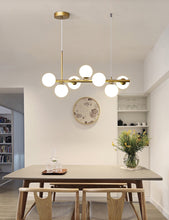 Load image into Gallery viewer, Polished Gold 7 Bulb Frosted Glass Chandelier
