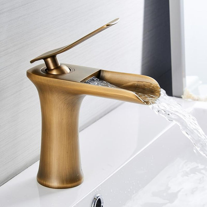 Modern single handle waterfall bathroom faucet in brass